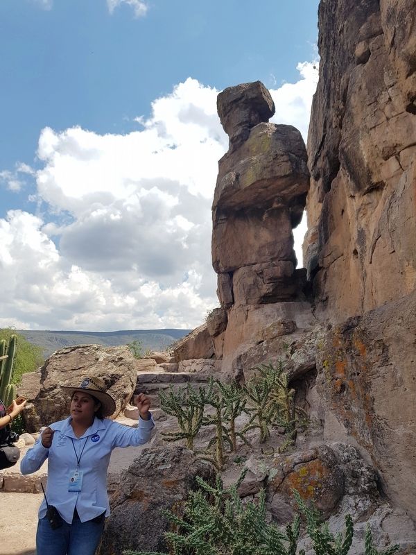 A guide explains the site near the marker with a 'guardian' rock formation in the background. Click for full size. A guide explains the site near the marker with a 'guardian' rock formation in the background image. Click for full size.