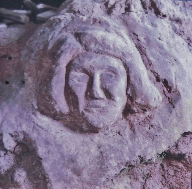 Marker detail: Sculptured face found in the basement of the Wesleyan Church image. Click for full size.