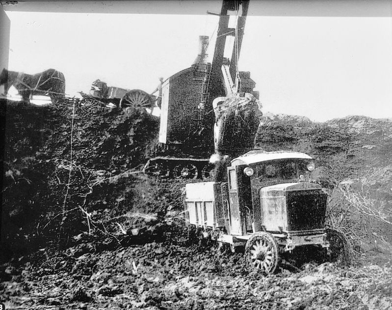 Marker detail: Steam shovel of Atlantic Gypsum loading truck in the quarry in Belle Marche • 1930 image. Click for full size.