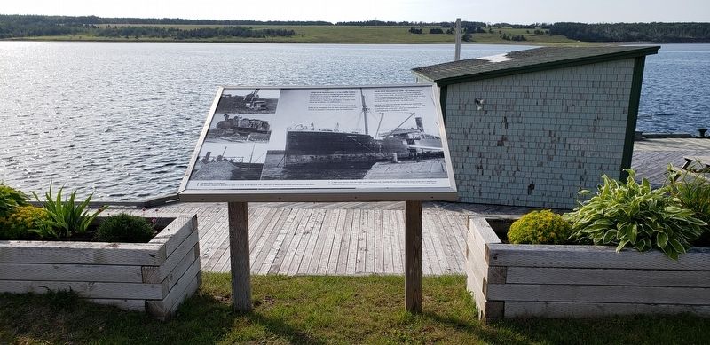 Railroad and "La Vieille Louise" Marker<br>(<i>wide view looking west across Chéticamp Harbor</i>) image. Click for full size.