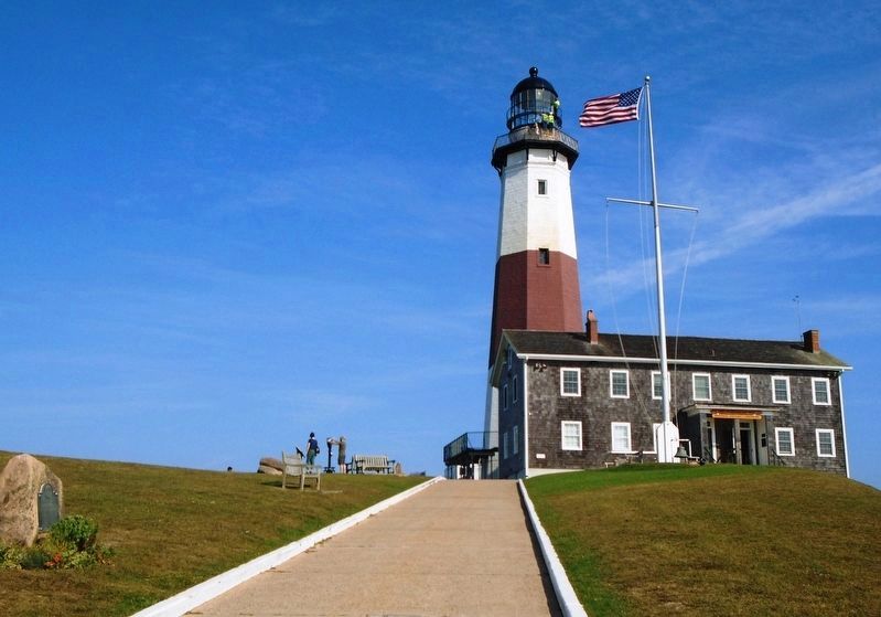 Montauk Lighthouse and Marker (at far left foreground). Click for full size. Montauk Lighthouse and Marker (at far left foreground) image. Click for full size.