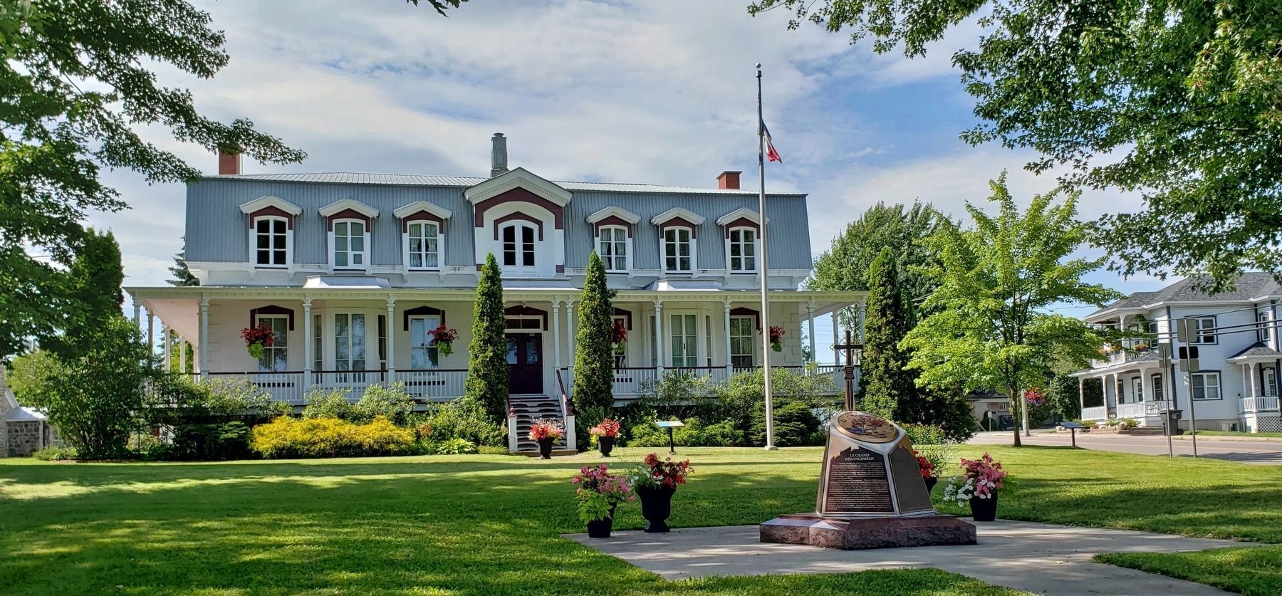 The Grand Dérangement Marker (<i>wide view • Saint-Grégoire Presbytery in background</i>). Click for full size. The Grand Dérangement Marker (<i>wide view • Saint-Grégoire Presbytery in background</i>) image. Click for full size.