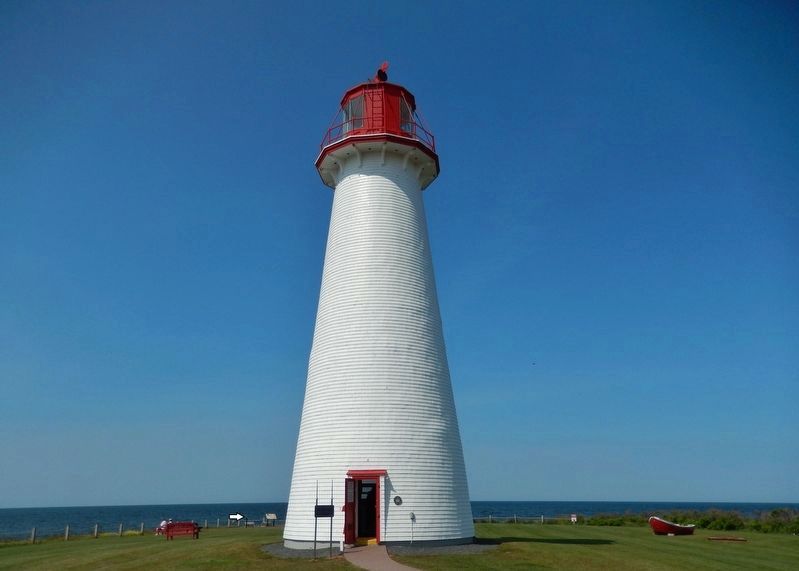 Point Prim Lighthouse  <i>view looking west<br>(marker visible, edge-on, far left background)</i> image. Click for full size.