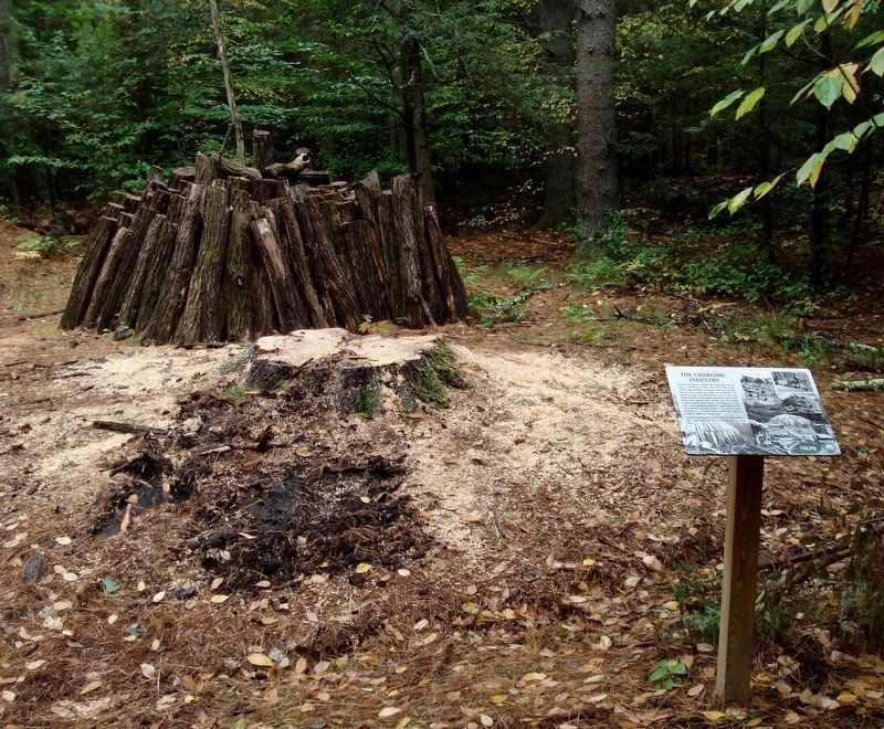 A demo of building a charcoal mound. image. Click for full size.