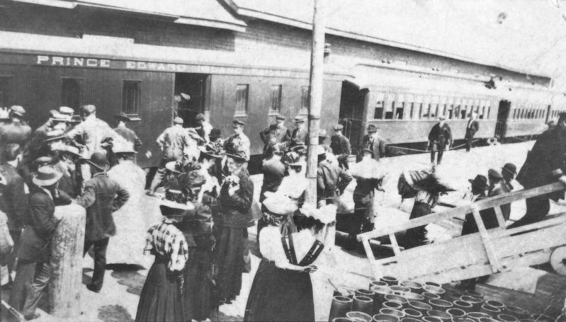 Marker detail: Passengers between the Charlottetown express and a docked steamer • c1910 image. Click for full size.