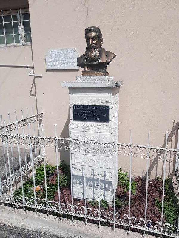 A monument to teacher Serafín Peña near the Purísima Cemetery Marker image. Click for full size.