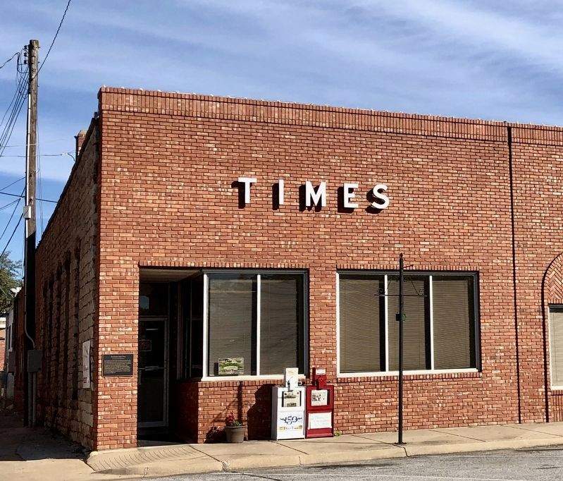 The current Harrison Daily Times building & marker image. Click for full size.