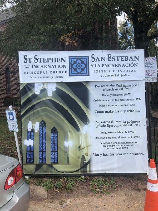Banner in English and Spanish on the church grounds image. Click for full size.