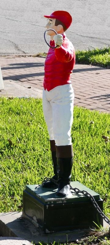 Lawn Jockey at street in front of house image. Click for full size.