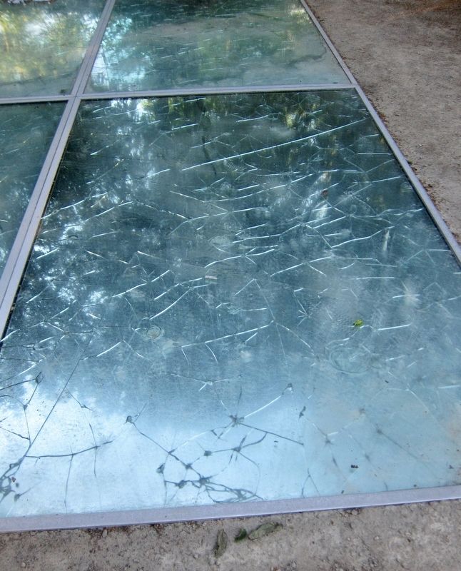 Auschwitz Monument (Mirror Monument) - broken mirror closeup. Click for full size. Auschwitz Monument (Mirror Monument) - broken mirror closeup image. Click for full size.
