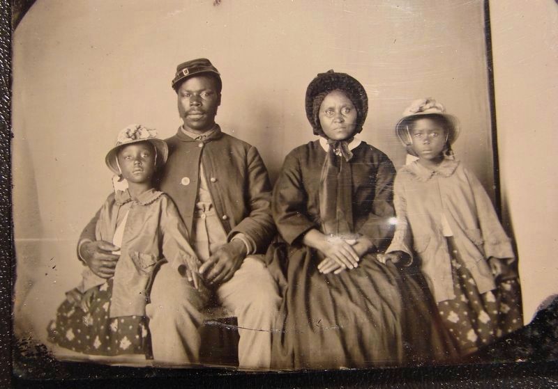 Unidentified USCT soldier with wife and daughters image. Click for full size.