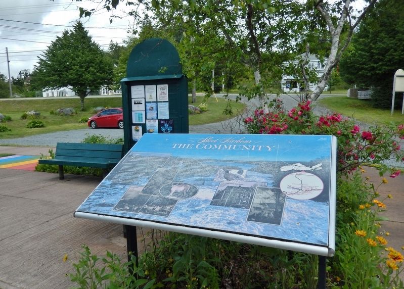 The Community Marker  <i>wide view<br>(Nova Scotia Trunk Highway 7 in background)</i> image. Click for full size.