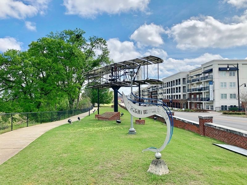 Marker is on the right of two on brick foundation below plane. image. Click for full size.