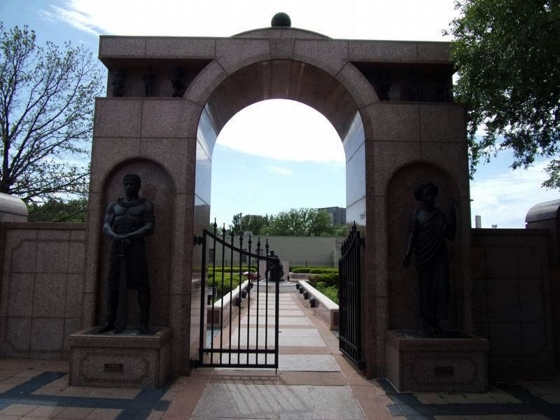Freedman's Cemetery entrance gate with statues image. Click for full size.