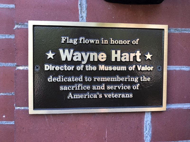Dedication plaque on the building image. Click for full size.