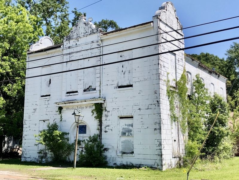 Church services originally held in this lodge next door.. Click for full size. Church services originally held in this lodge next door. image. Click for full size.