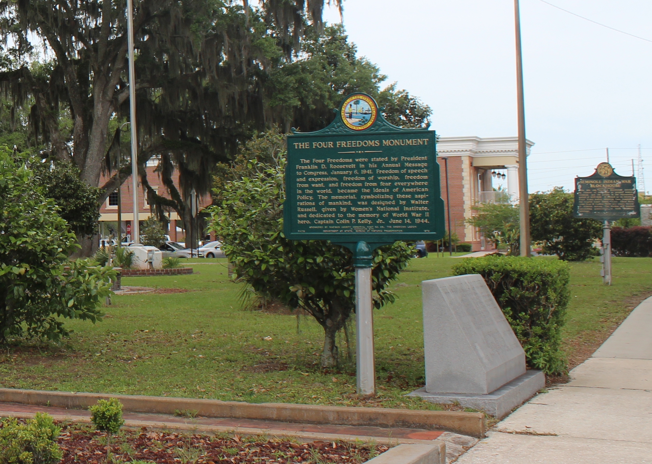 Seminole Indian War Blockhouse Marker in background with Four Freedoms Monument Marker in foreground