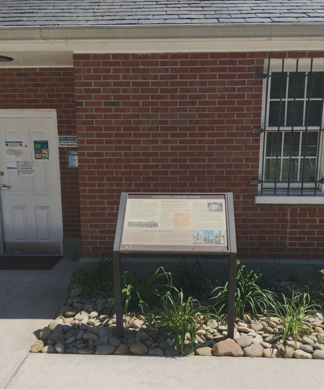 A National Cemetery System Marker shown from a distance.. Click for full size. A National Cemetery System Marker shown from a distance. image. Click for full size.