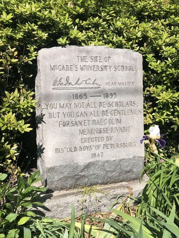 A plaque noting the location of McCabe's University School, to the south along South Sycamore Street. Click for full size. A plaque noting the location of McCabe's University School, to the south along South Sycamore Street image. Click for full size.