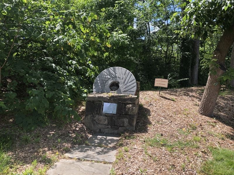 Cloud's Mill Race marker in a display of a millstone image. Click for full size.