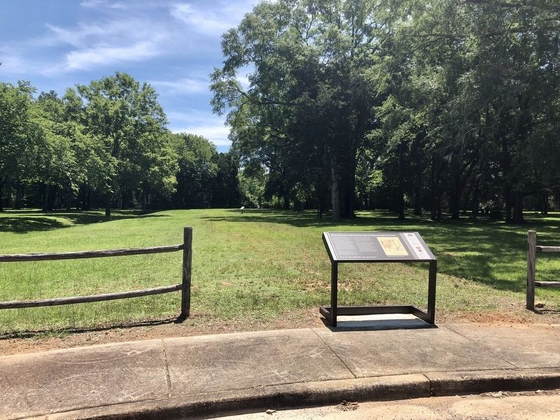 View of marker in front of flat-topped mound between the moat. image. Click for full size.