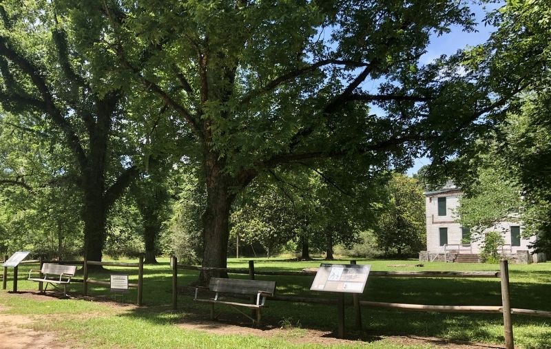 View of former slave quarters and two markers. image. Click for full size.