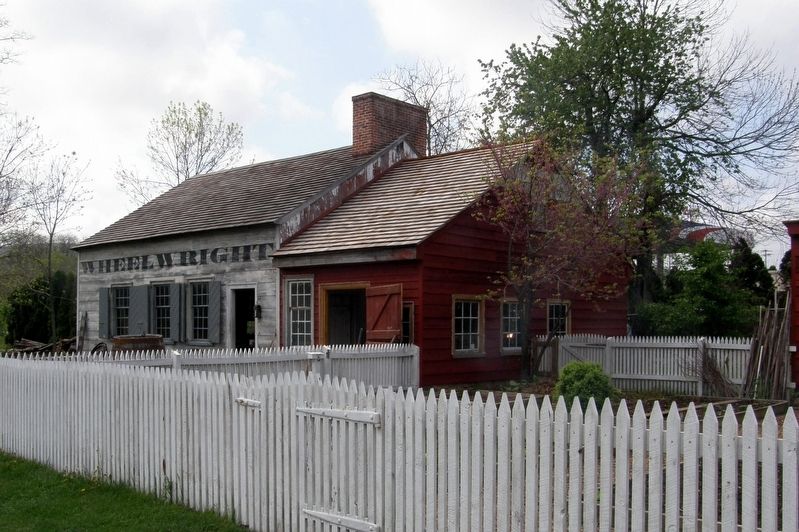 The wheelwright/blacksmith shop and the distillery image. Click for full size.