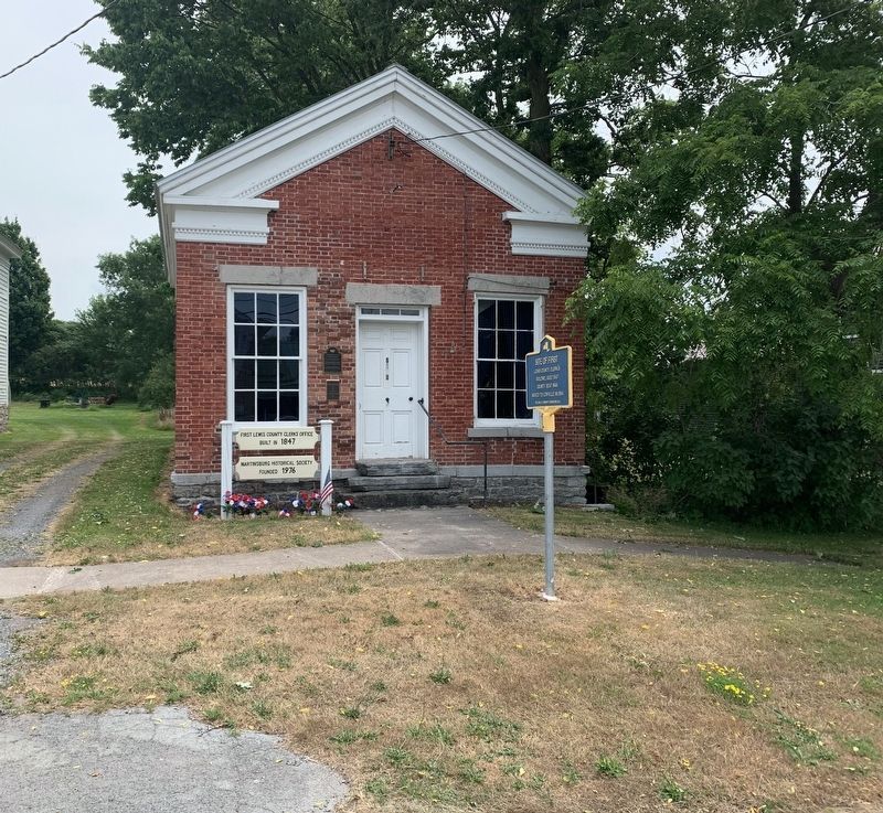 Site of First Lewis County Clerks Building Marker. Click for full size. Site of First Lewis County Clerks Building Marker image. Click for full size.