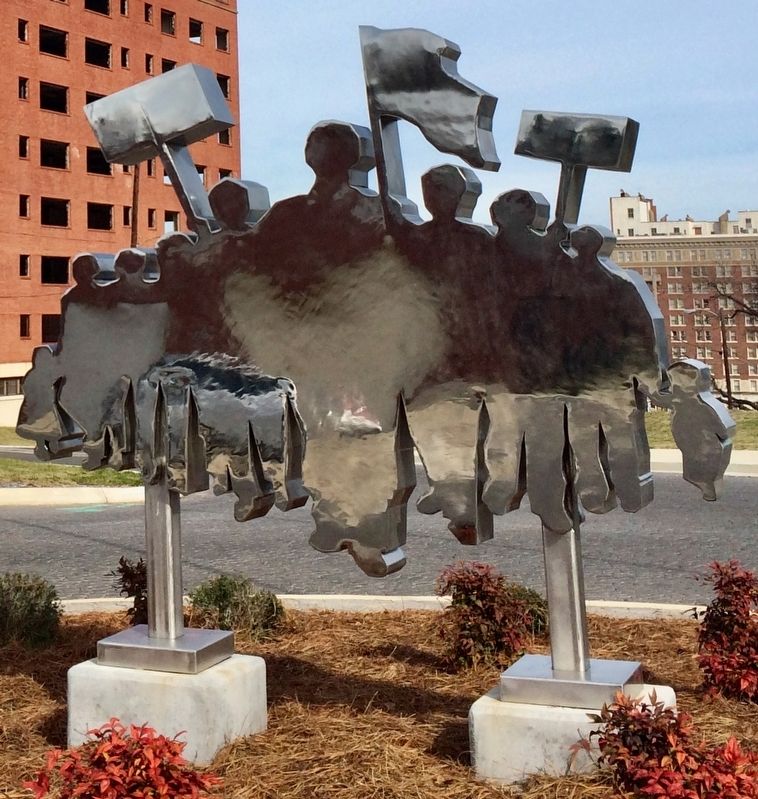Stainless steel artwork showing a civil rights protest group. image. Click for full size.