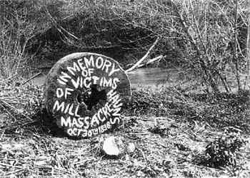 Early memorial to the Haun's Mill massacre, painted on the millstone. image. Click for full size.