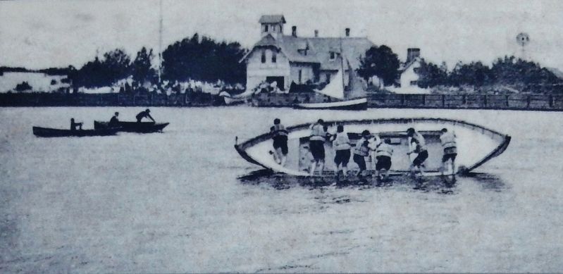 Marker detail: A lifeboat capsizing drill in the Grand River in front of the Life Saving Station. Click for full size. Marker detail: A lifeboat capsizing drill in the Grand River in front of the Life Saving Station image. Click for full size.