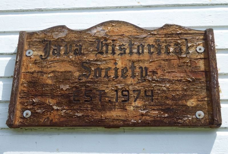 Sign on the schoolhouse image. Click for full size.