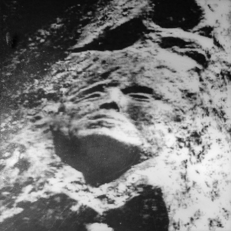 Marker detail: Face in the rock - 1962 image. Click for full size.