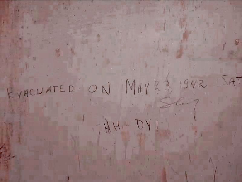 Departure Date written on bedroom wall image. Click for full size.