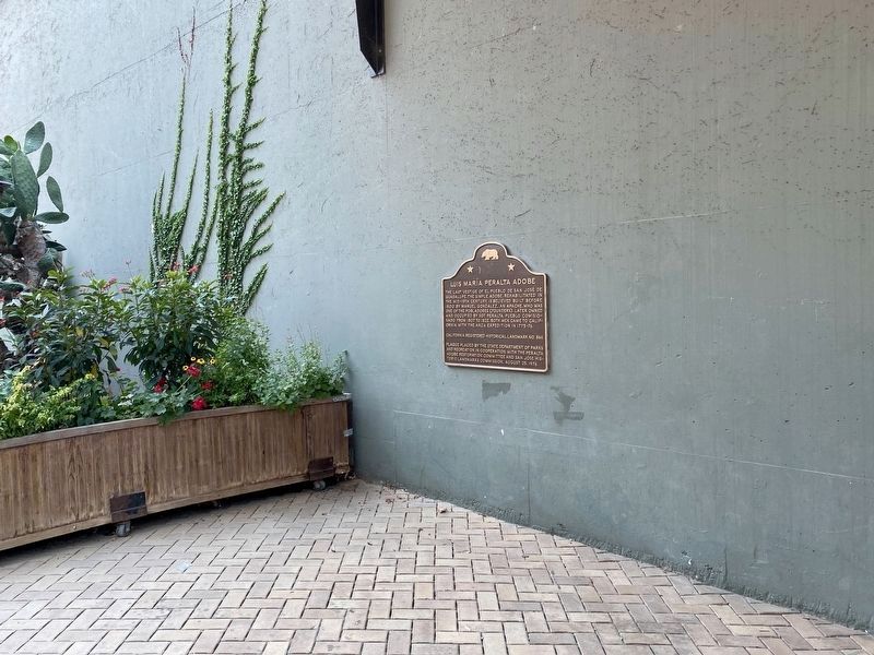 Luis Mara Peralta Adobe Marker - duplicate, visible through the West St. John Street gate image. Click for full size.