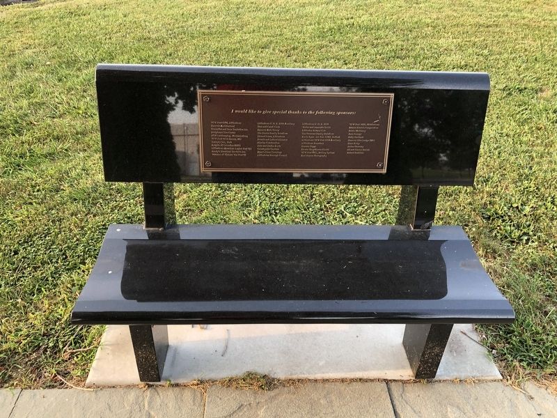 Donor plaque on a bench at the memorial image. Click for full size.