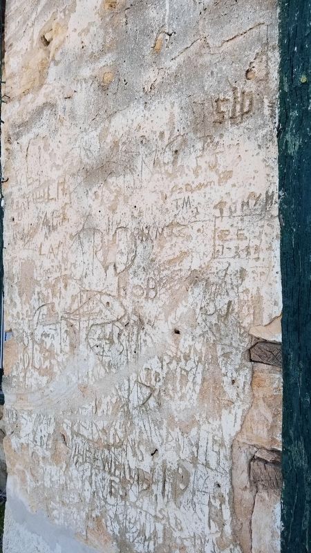 Graffiti and bullet holes at the Old Rock Store image. Click for full size.