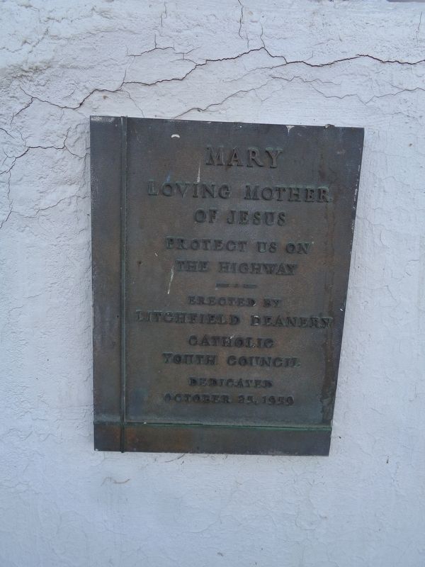 Close up of plaque under the shrine image. Click for full size.