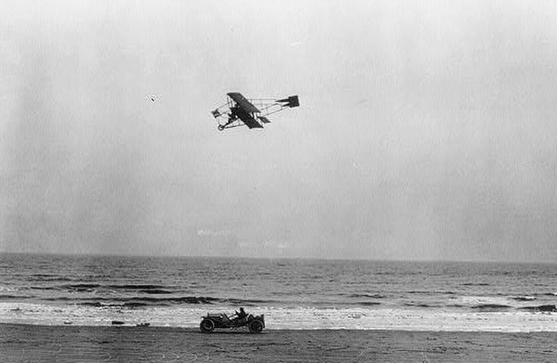 Charles K. Hamilton racing against an automobile on a beach in Galveston, Texas.. Click for full size. Charles K. Hamilton racing against an automobile on a beach in Galveston, Texas. image. Click for full size.