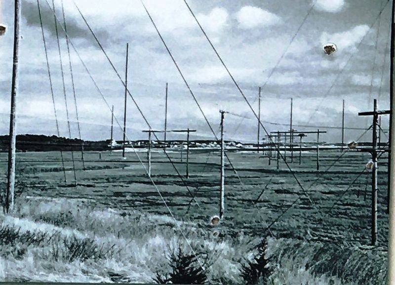 Marker photo: Looking east, the wires created a web across the marsh. image. Click for full size.