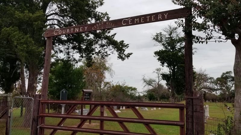 The front gate to the Courtney Cemetery with the marker image. Click for full size.
