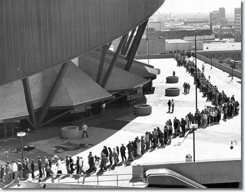 Fans line up at the arena image. Click for full size.