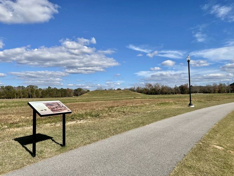 Archaic Marker with reconstructed mound in background. image. Click for full size.