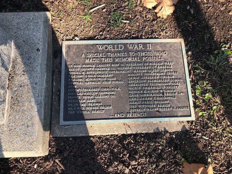 Dedication plaque adjacent to the memorial image. Click for full size.