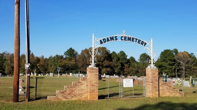The main gate for the Adams Cemetery with the Marker in the background. image. Click for full size.