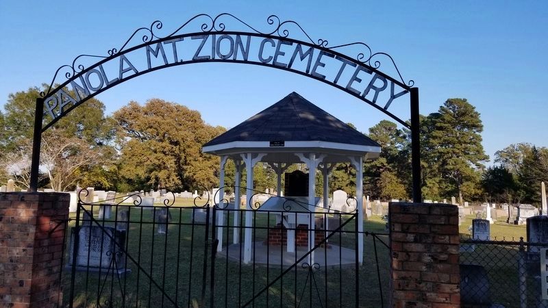 The Mt. Zion Cemetery Marker is behind the front gate of the cemetery under the shelter image. Click for full size.