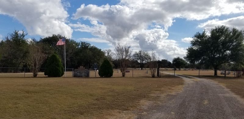 The front entrance to the Smith Bend - Coon Creek Cemetery with the marker image. Click for full size.