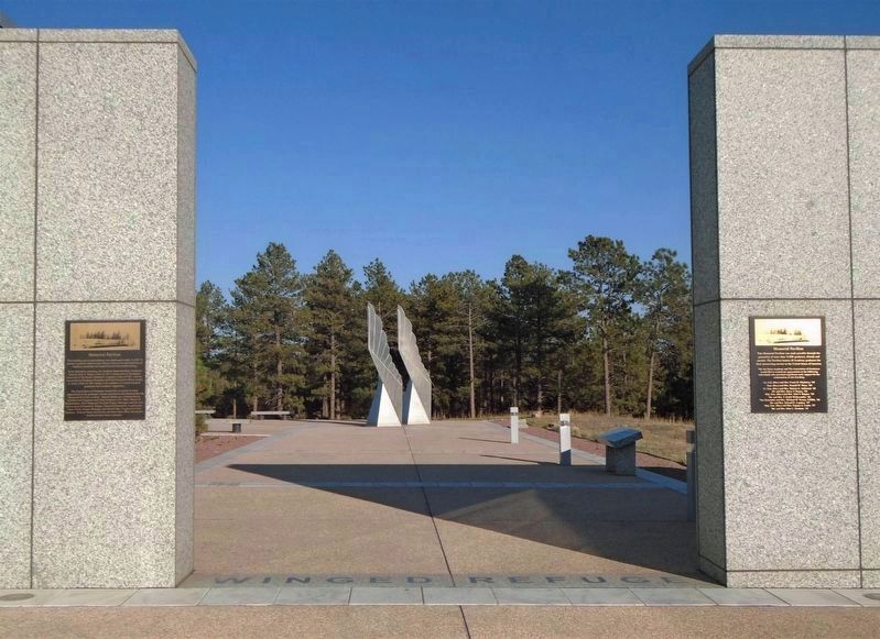 Marker (beyond opening) and <i>Winged Refuge</i> Sculpture. Click for full size. Marker (beyond opening) and <i>Winged Refuge</i> Sculpture image. Click for full size.