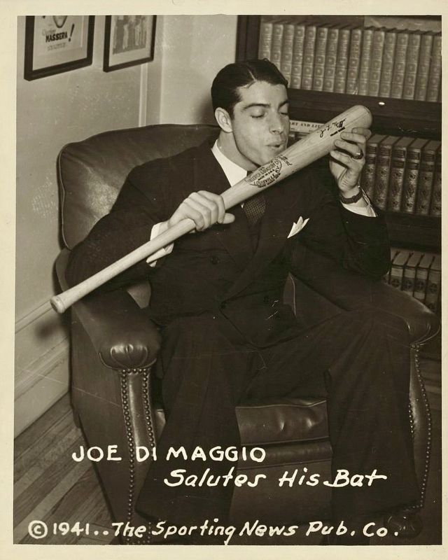 <i>Joe DiMaggio salutes his bat</i> image. Click for full size.