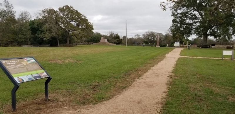 The Burning of San Felipe Marker with the Stephen F. Austin Memorial in the background.. Click for full size. The Burning of San Felipe Marker with the Stephen F. Austin Memorial in the background. image. Click for full size.